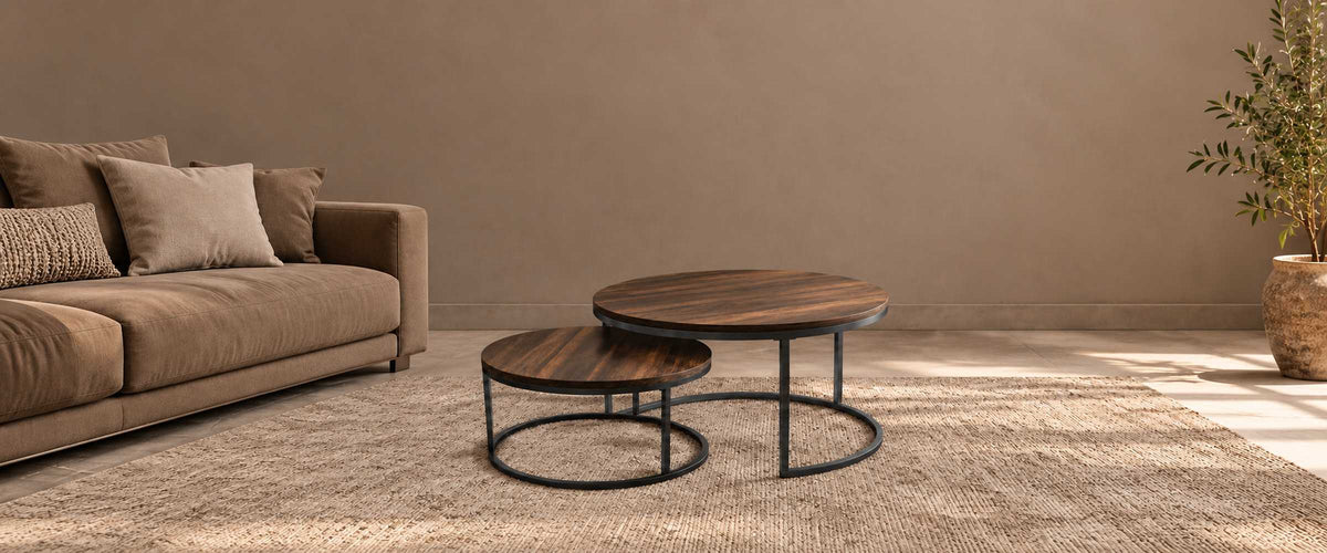Dark walnut Maywood round nesting tables with black metal frames in a warm neutral living room