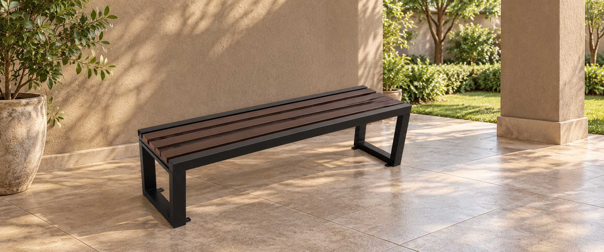 Dark brown four-slat backless garden bench with black metal frame on a naturally daylit covered veranda