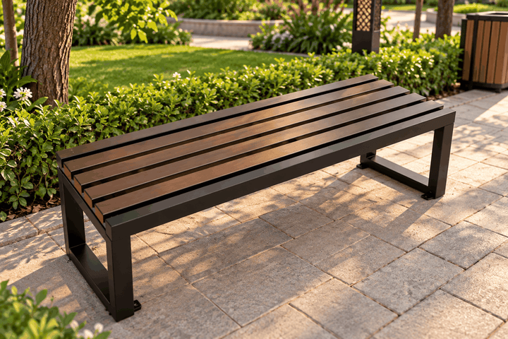 Brown slatted outdoor bench with a black frame beside a garden path