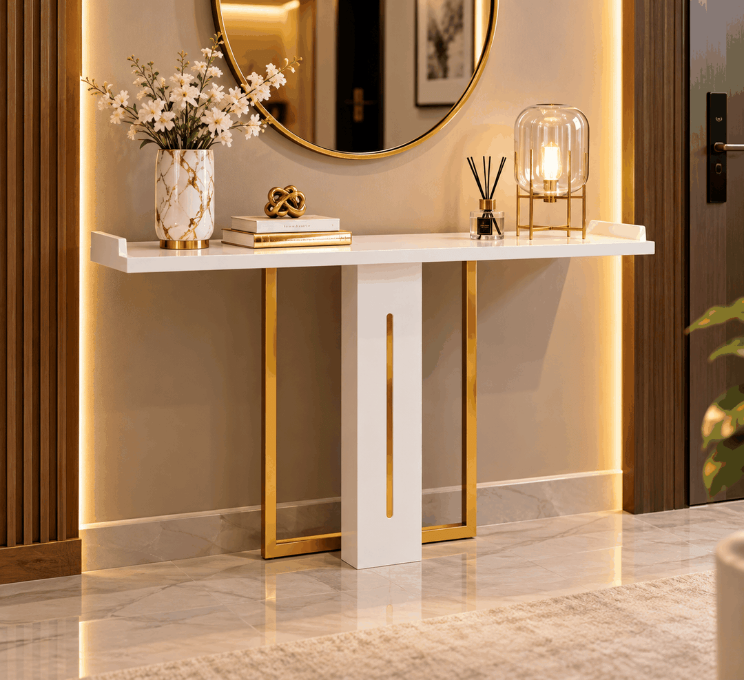White and gold console table styled beneath a round wall mirror