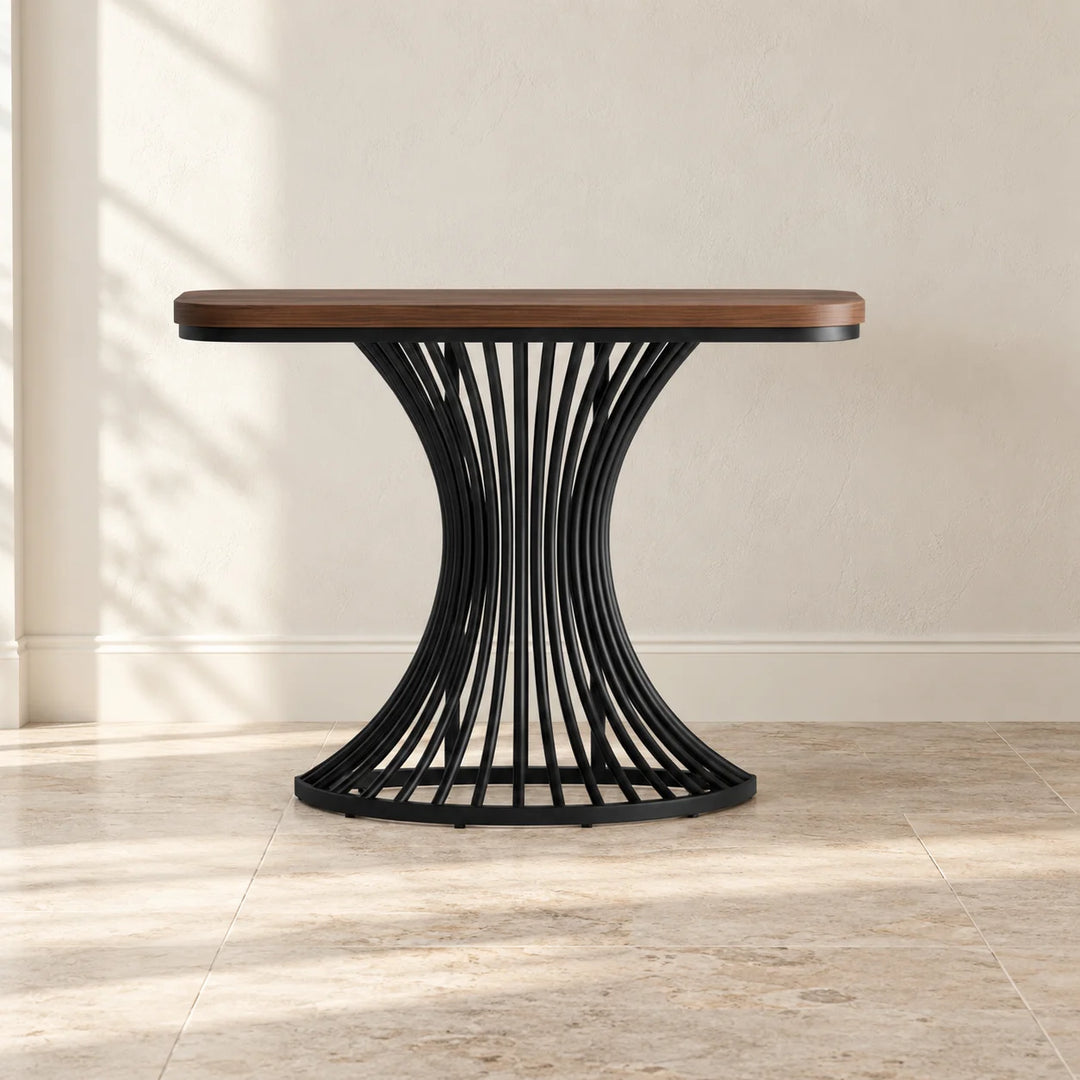Amorin console table with walnut brown top and black curved metal base in natural light
