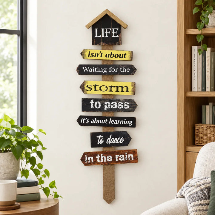 Black and yellow signpost wall caption decor with dance in the rain quote in living room