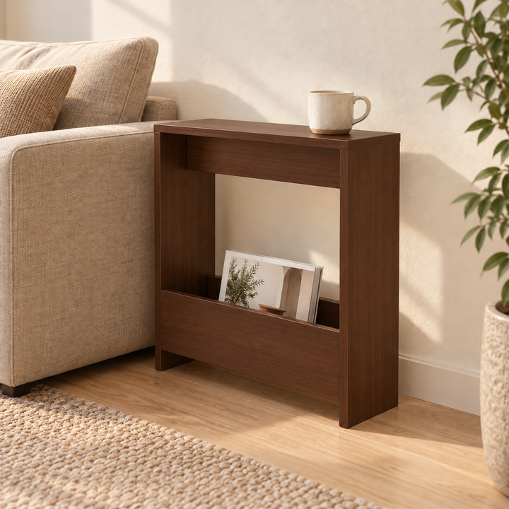 Brown Boconic slim side table with magazine pocket and mug beside a beige sofa