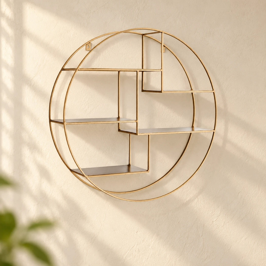 Champagne-gold circular wall shelf with five stepped empty shelves on a softly sunlit neutral wall