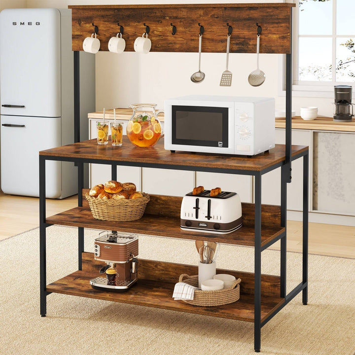 Kitchen island bakers rack with microwave on top and baskets on lower shelves