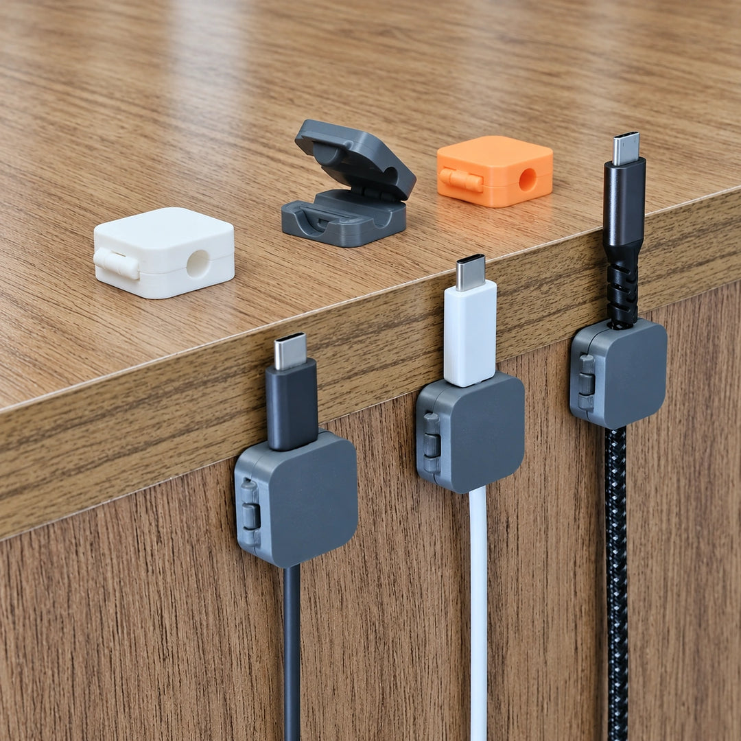 3D printed cable organizer clips showing hinged lids and desk mounting