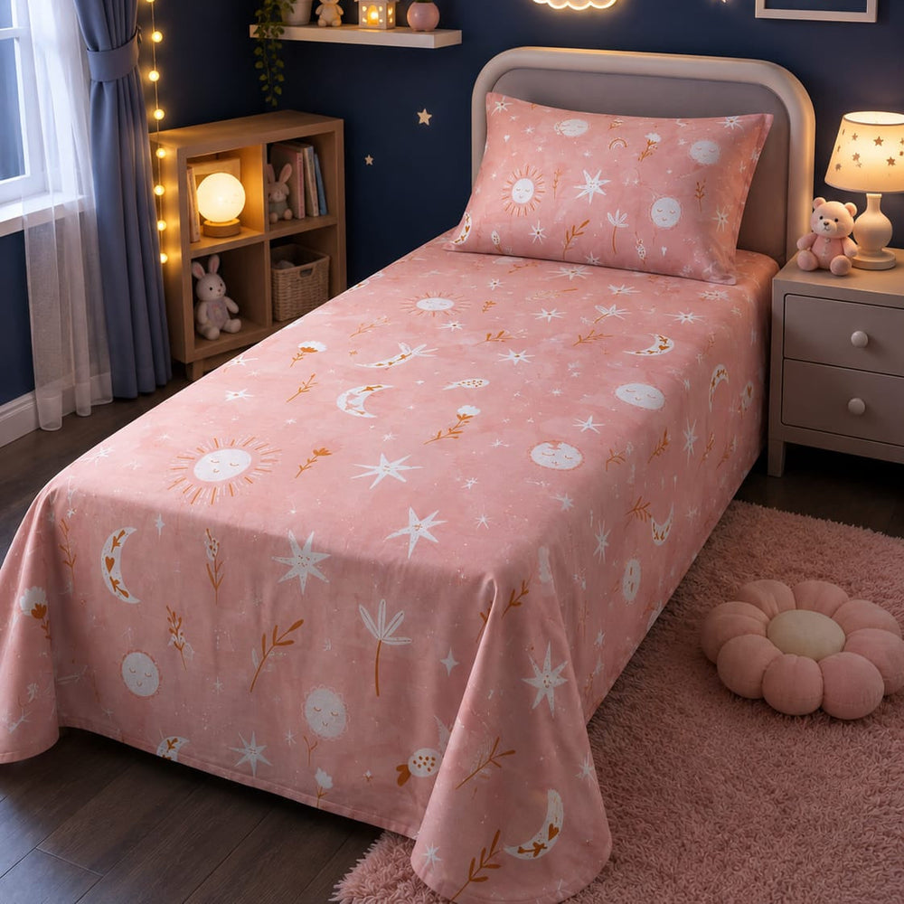 Peach-pink celestial print kids single bed sheet with sun, moon and star design