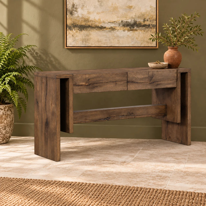 Cleavo rustic console table styled with a vase and key dish beside a natural fern