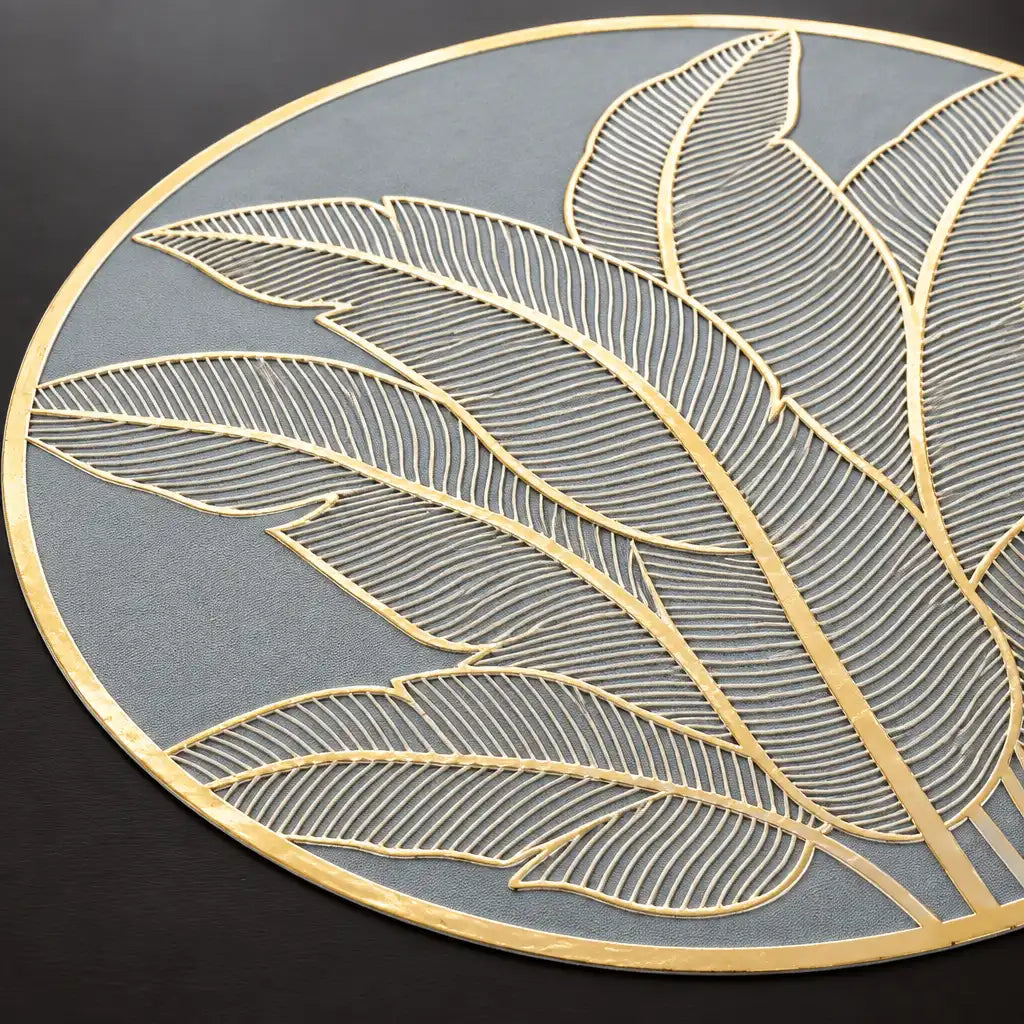 Close-up of grey round table topper mat with gold leaf pattern