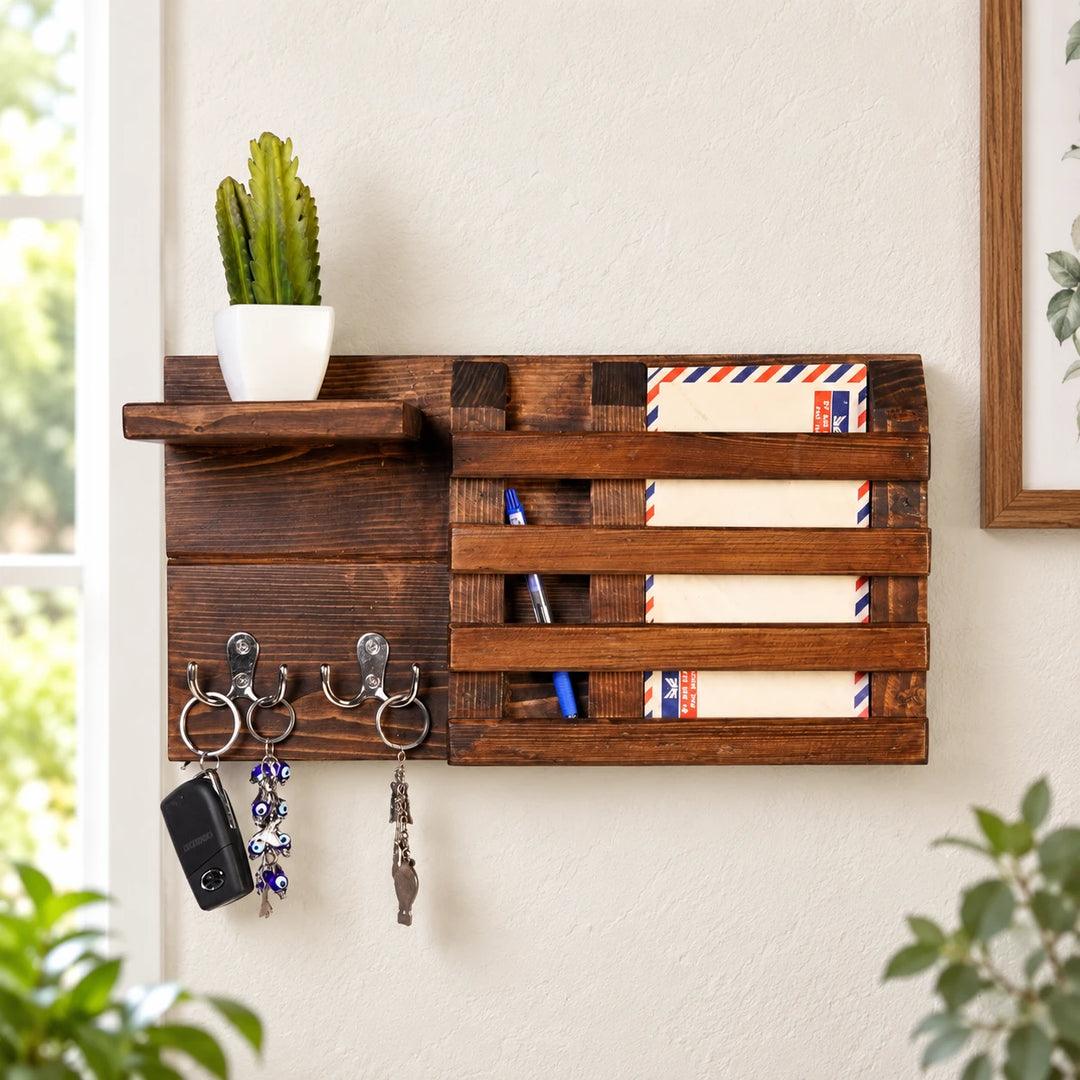 Dark wooden wall organizer with hooks and mail slots in a sunlit entryway