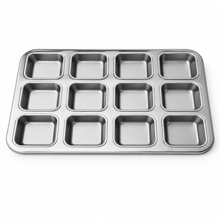 Twelve-cup metal baking muffin pan with square moulds, top view on white background