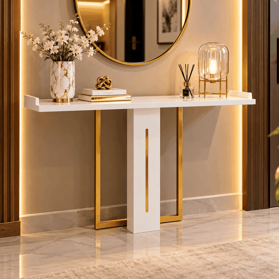 White and gold console table styled beneath a round wall mirror