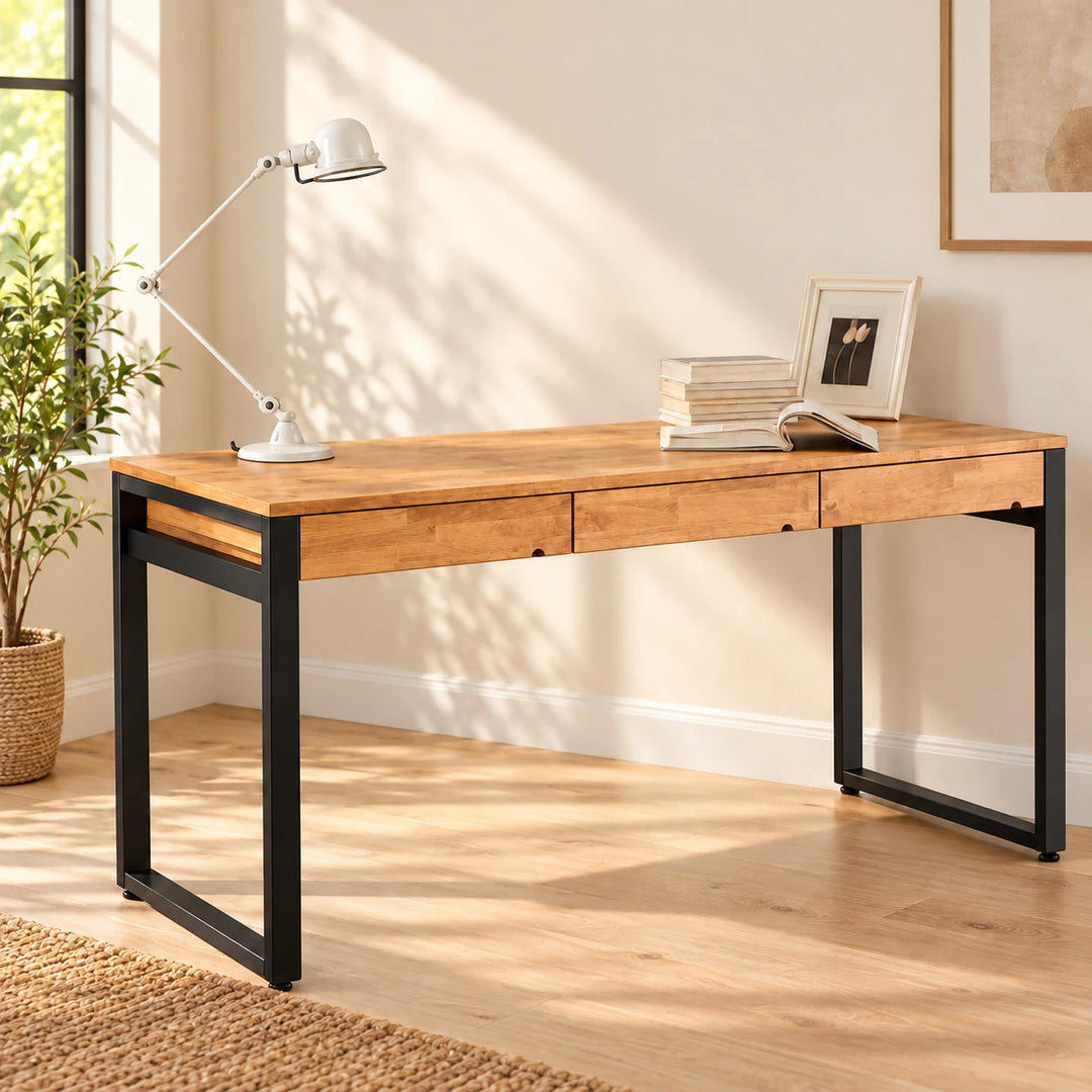 Copse natural wood desk with three slim drawer fronts and black rectangular metal frame in a bright home study