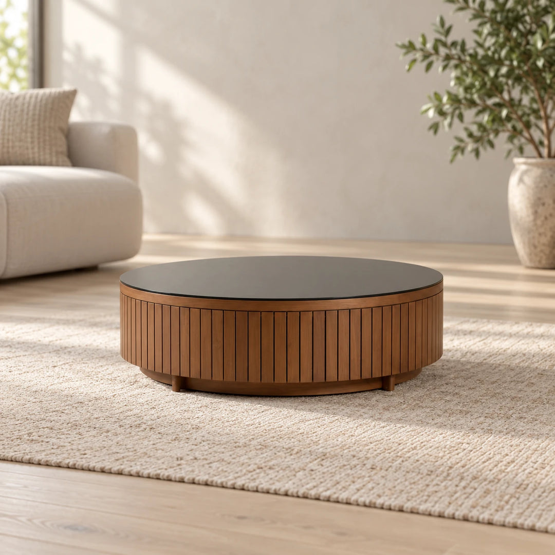 Brown round slatted side table with dark top in a sunlit room