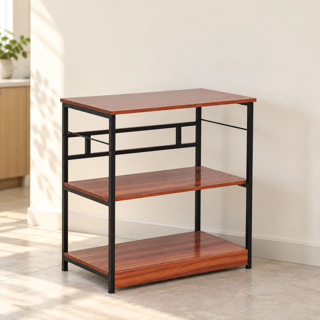 Dainty three-tier rack with red-brown shelves and a black frame in a naturally lit home kitchen corner