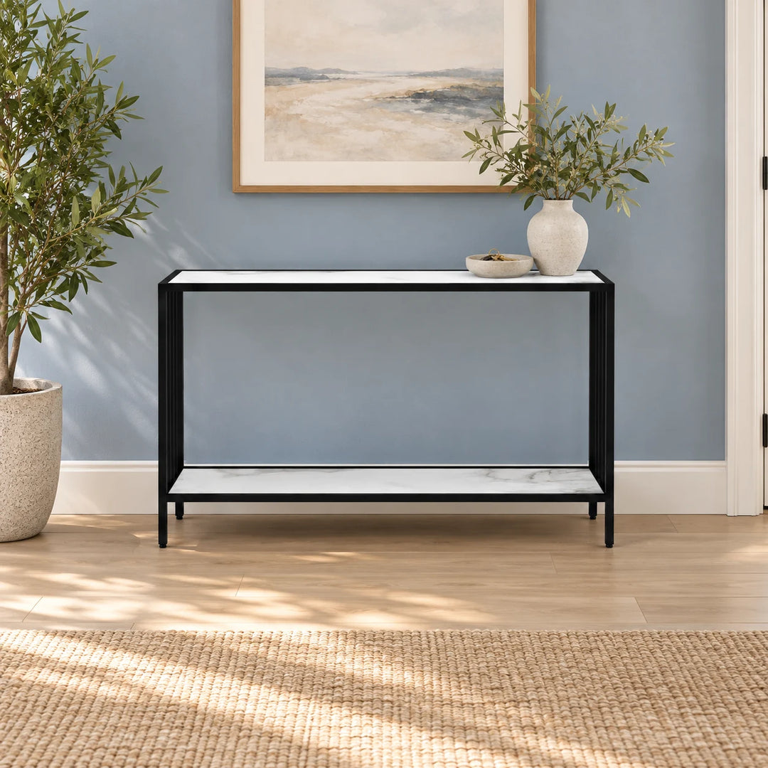 Decigi black frame console with pale shelves styled with a vase and natural plant