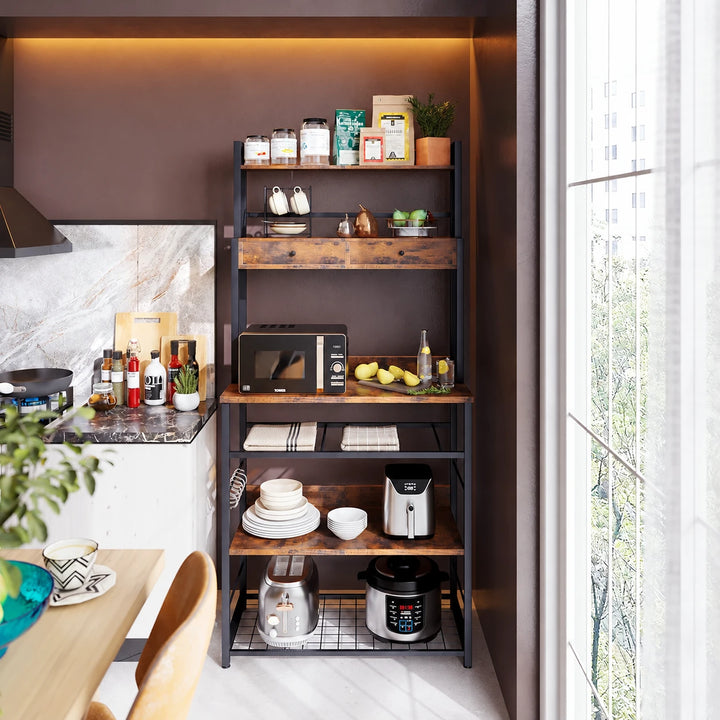 Brown and black Doku kitchen rack with drawers, cookware and folded towels in a sunlit kitchen