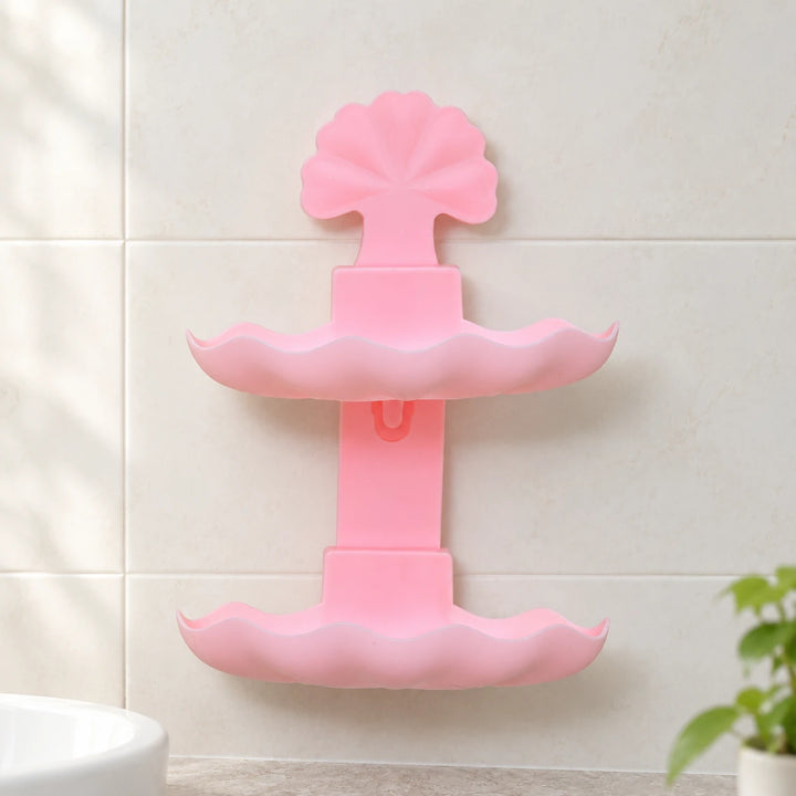 Pink two-tier leaf soap rack on a bathroom wall