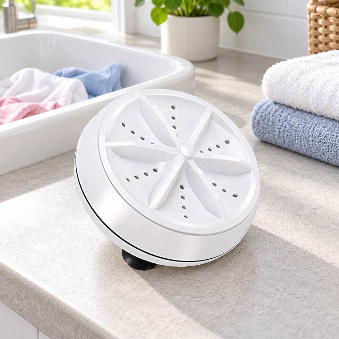 White mini turbine unit beside laundry basin and folded towels