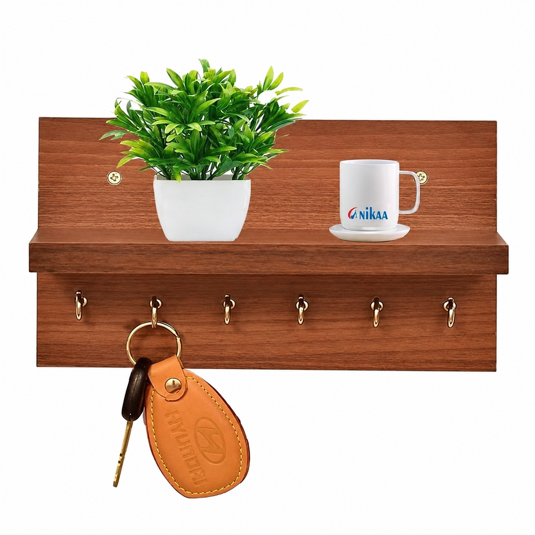 Wooden wall mounted key holder shelf with hooks, plant, mug and hanging keys