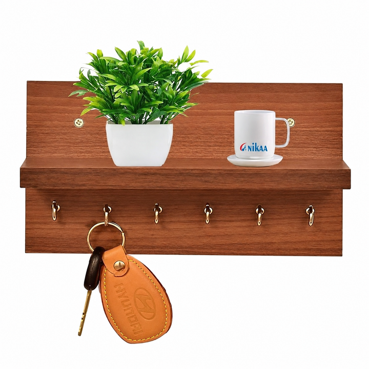 Wooden wall mounted key holder shelf with hooks, plant, mug and hanging keys