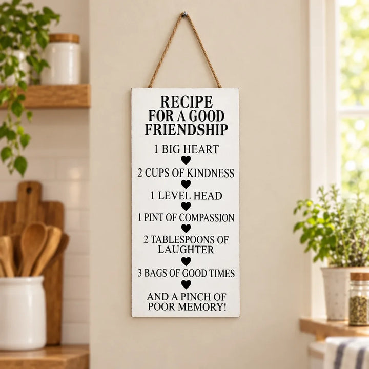 White hanging wall caption decor plaque with recipe for a good friendship text in kitchen