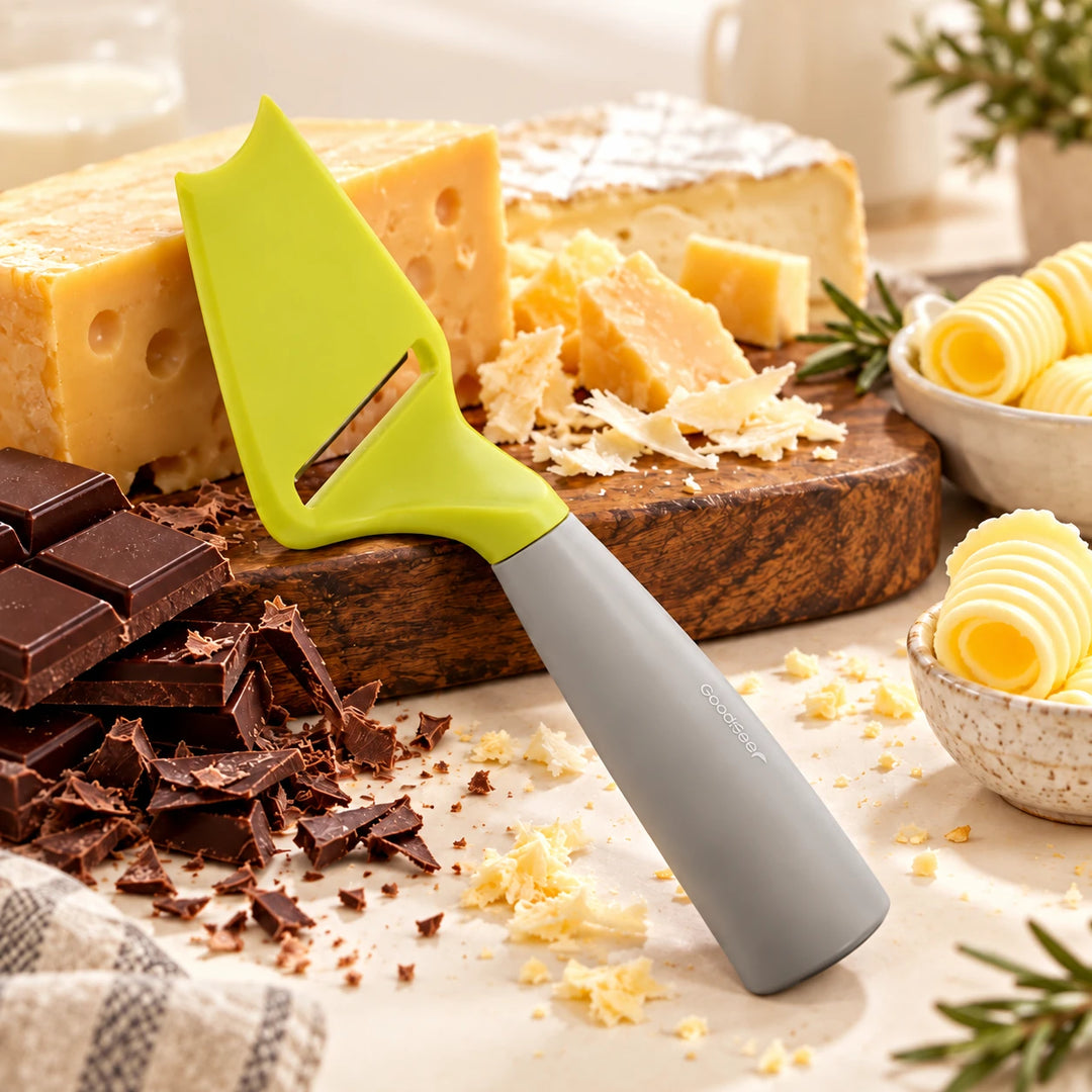 Lime and grey Goodfeer slicer beside cheese, chocolate and butter in a kitchen setting