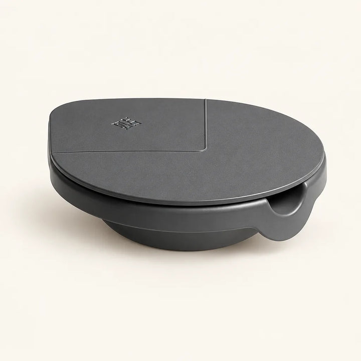 Dark grey masked ashtray with sliding lid, closed front view