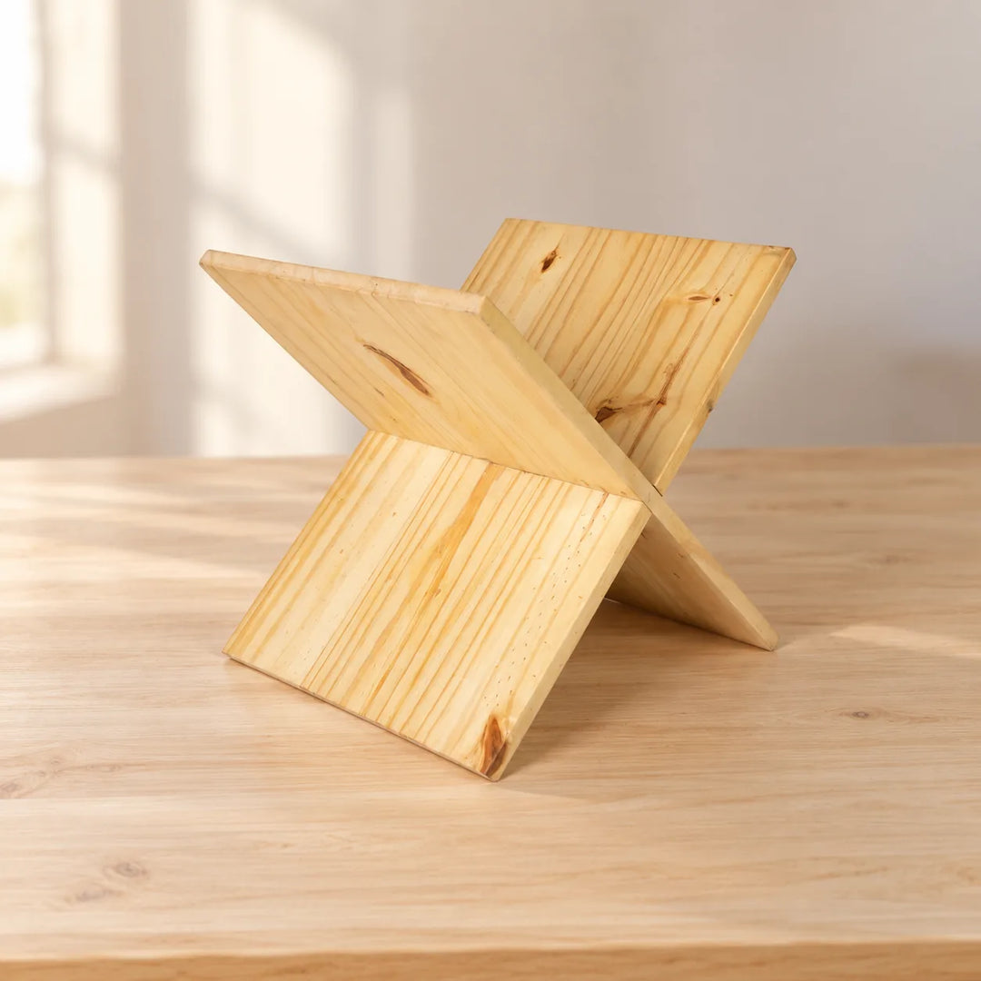 Empty Holy Book solid wood reading stand with two interlocking boards on a softly lit tabletop