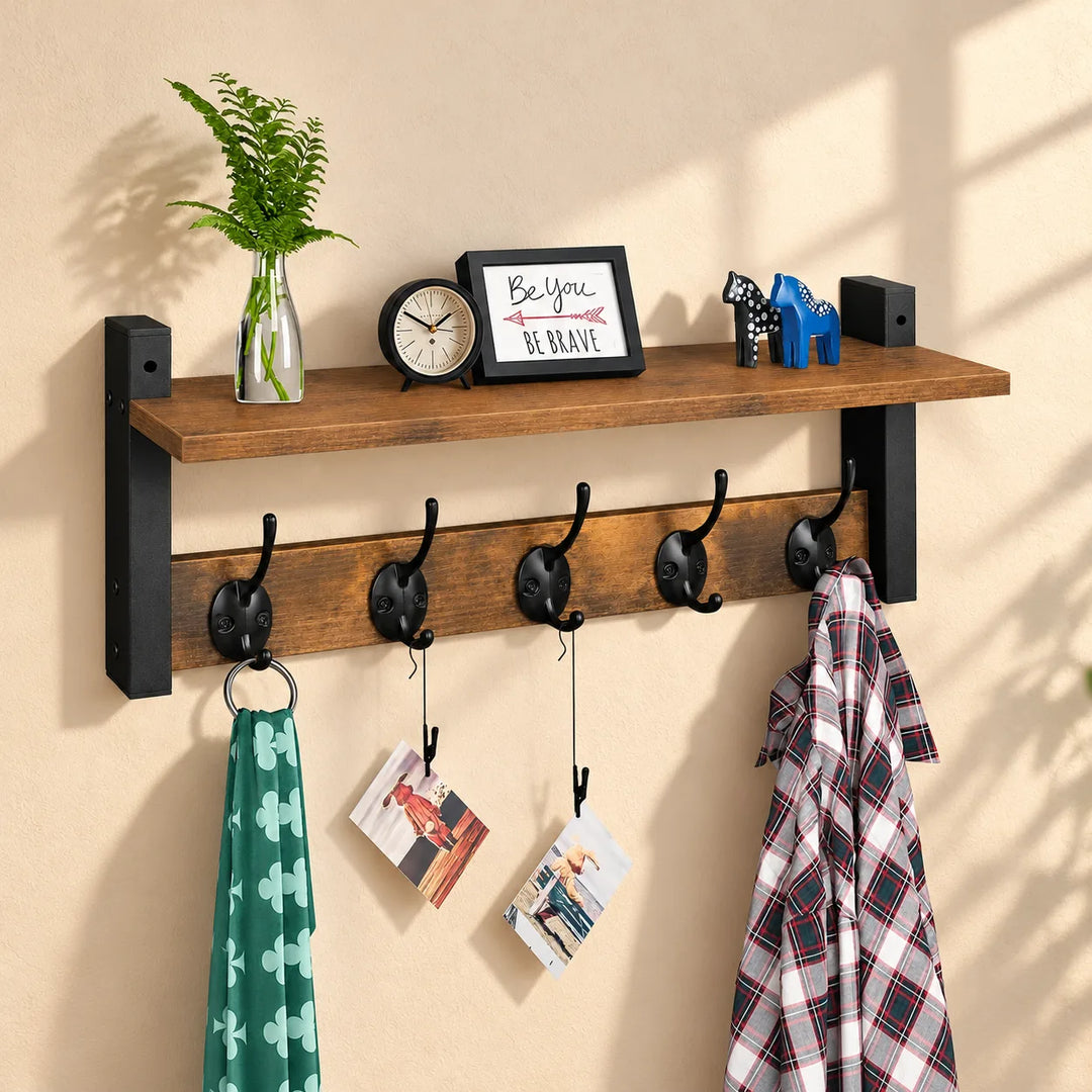 Homode brown wall shelf with five black double hooks and existing decorative accessories in a softly lit entryway