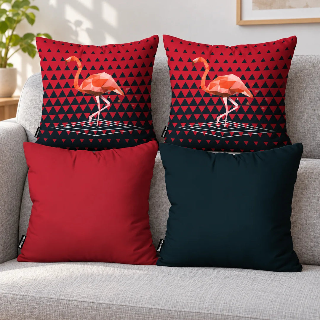 Four Ismera cushion covers: two matching geometric flamingo prints, one plain red and one dark blue-green, arranged on a sofa