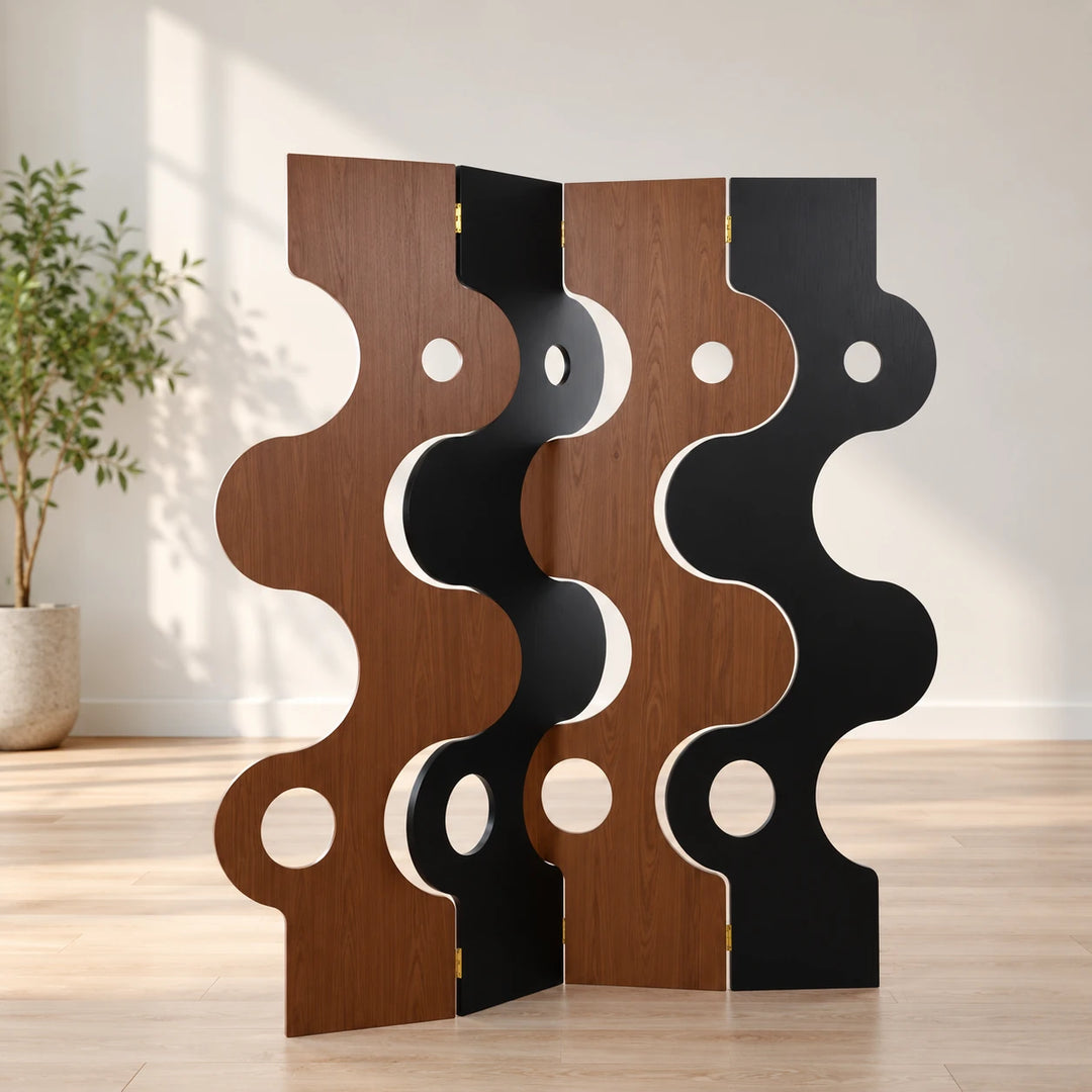Brown and black Junyo divider with four wavy panels and round openings in a sunlit room