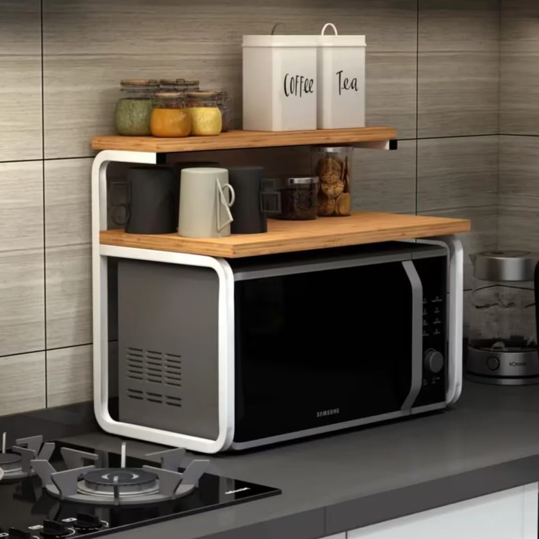 Wood and white metal counter top rack over microwave with jars on top shelf
