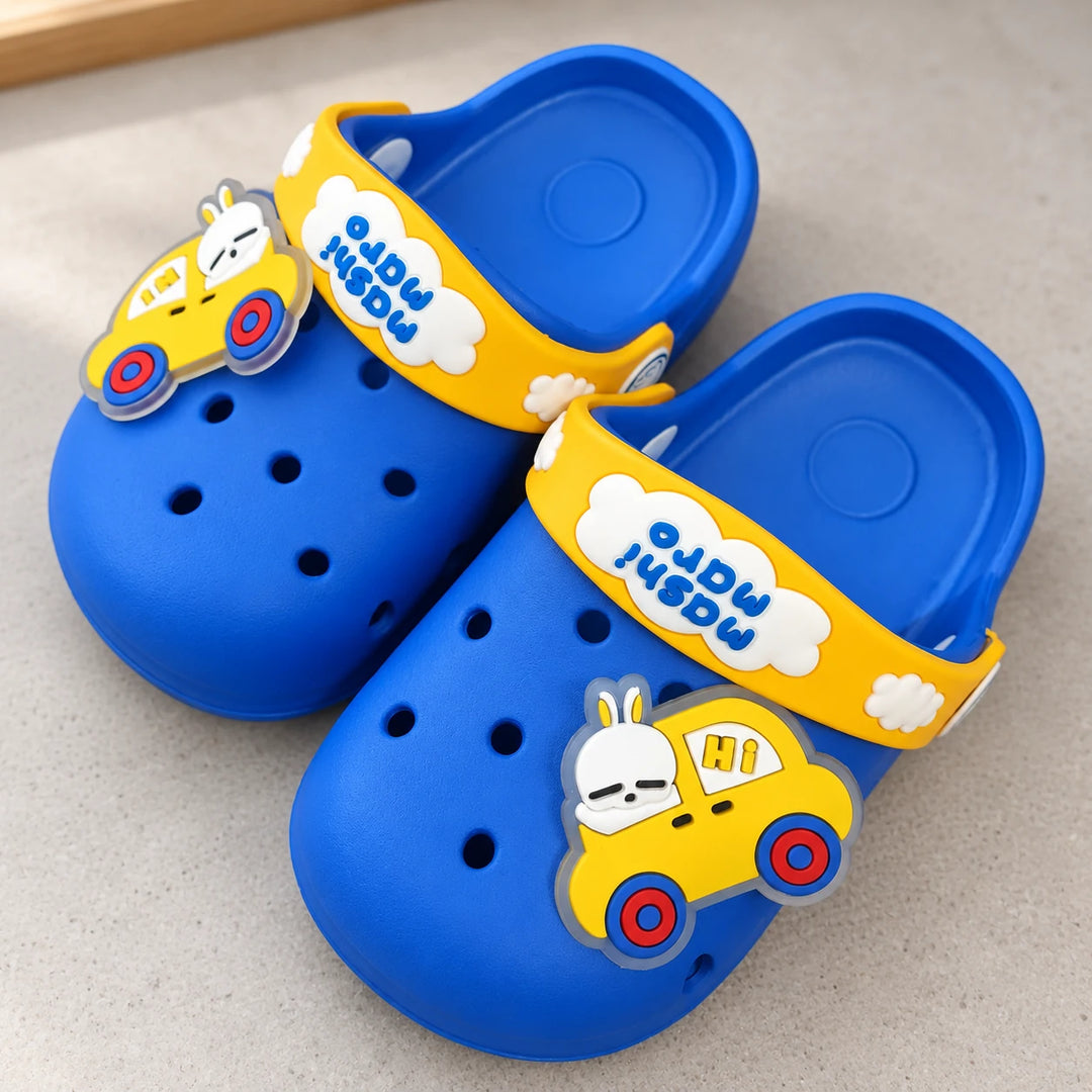 Blue and yellow Masni slippers with rabbit car charms in natural light