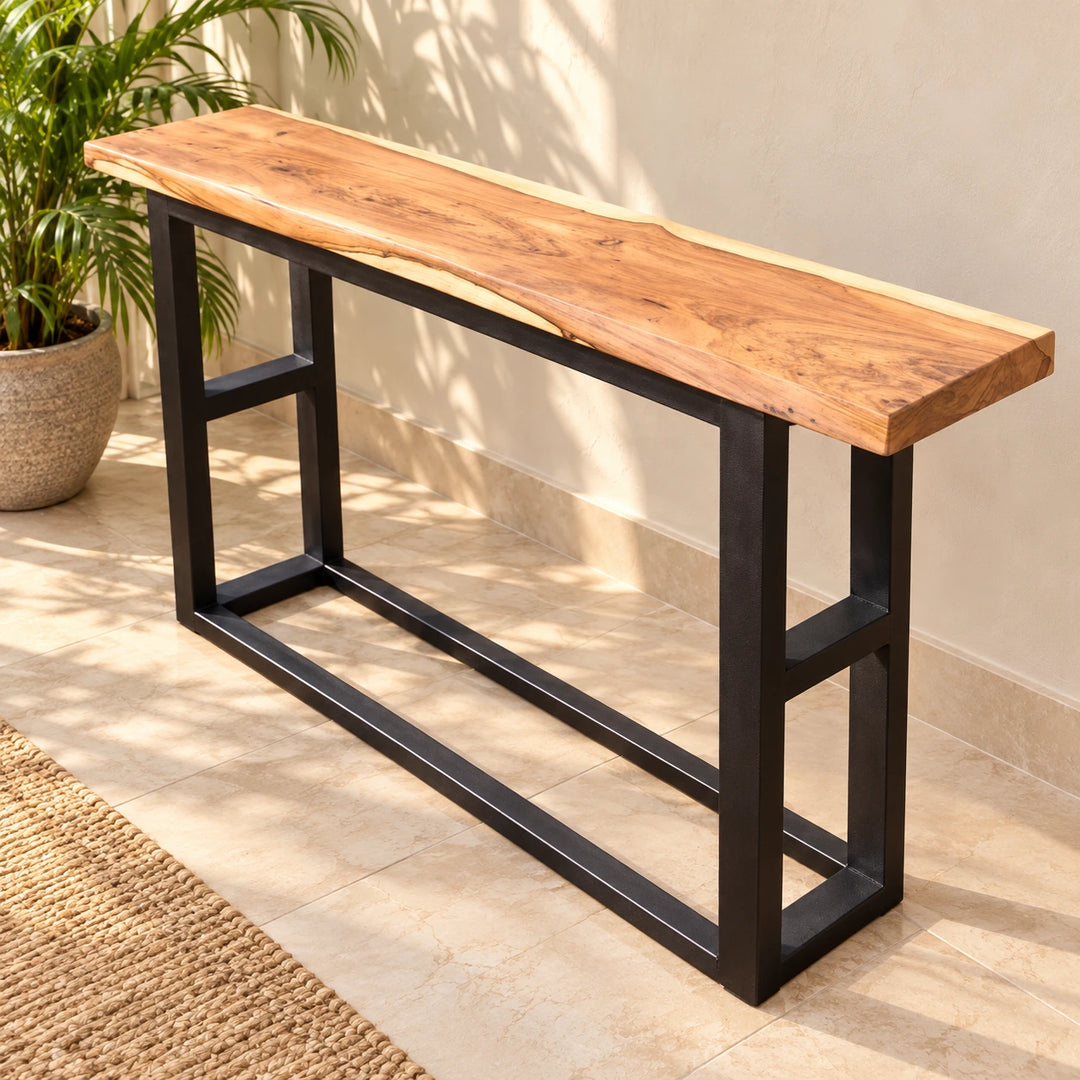 Mesade solid wood console table with black rectangular metal frame in a naturally lit home entryway
