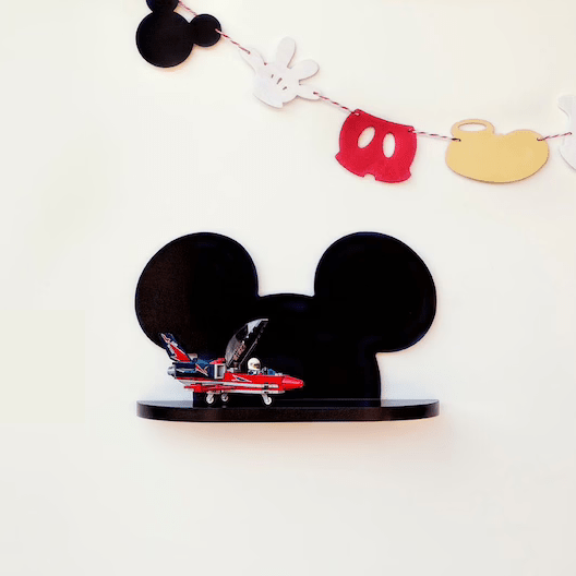 Black Mickey Mouse floating wall shelf holding toy car under character garland