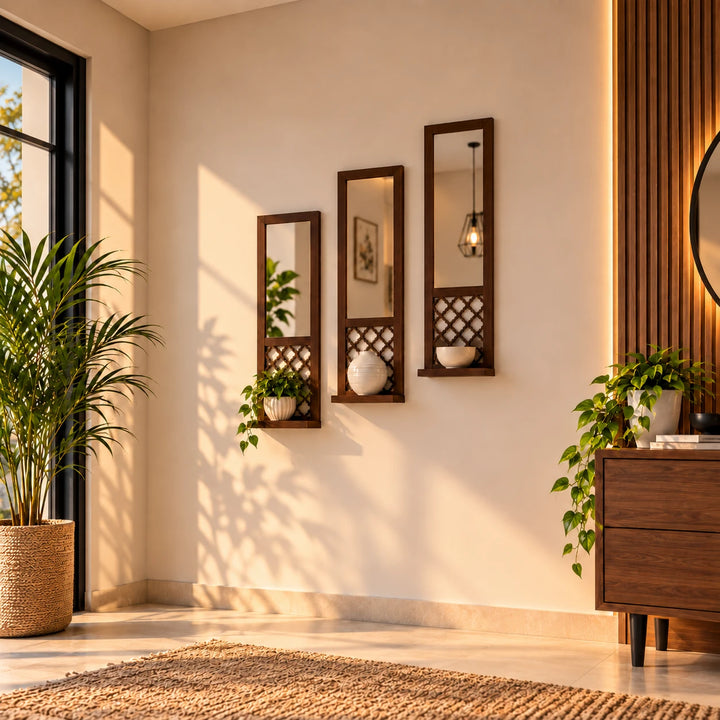 Set of three dark wood wall mirrors with lattice shelves styled with a plant, vase and bowl