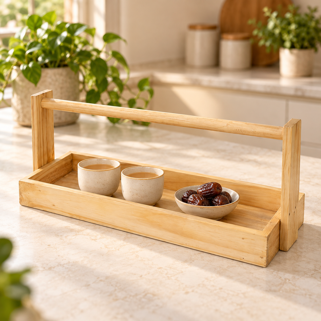 Natural pine serving tray with tall wooden handle styled with tea in a sunlit kitchen