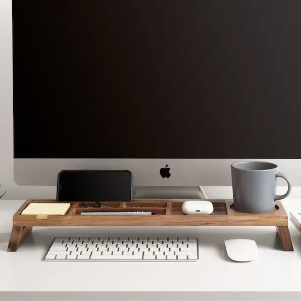 Wooden desk organizer docking station under computer monitor with keyboard
