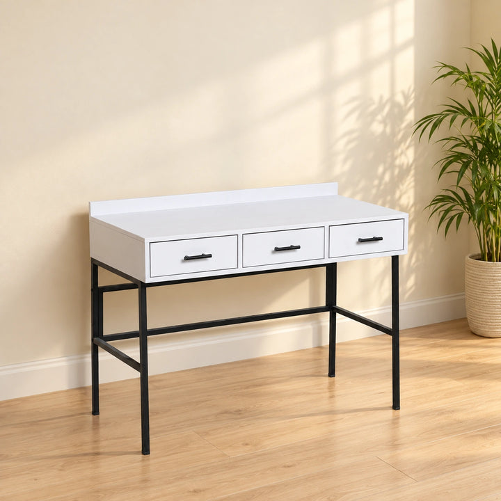 White Night Vasal three-drawer writing desk with black handles and frame in a warm daylight home office