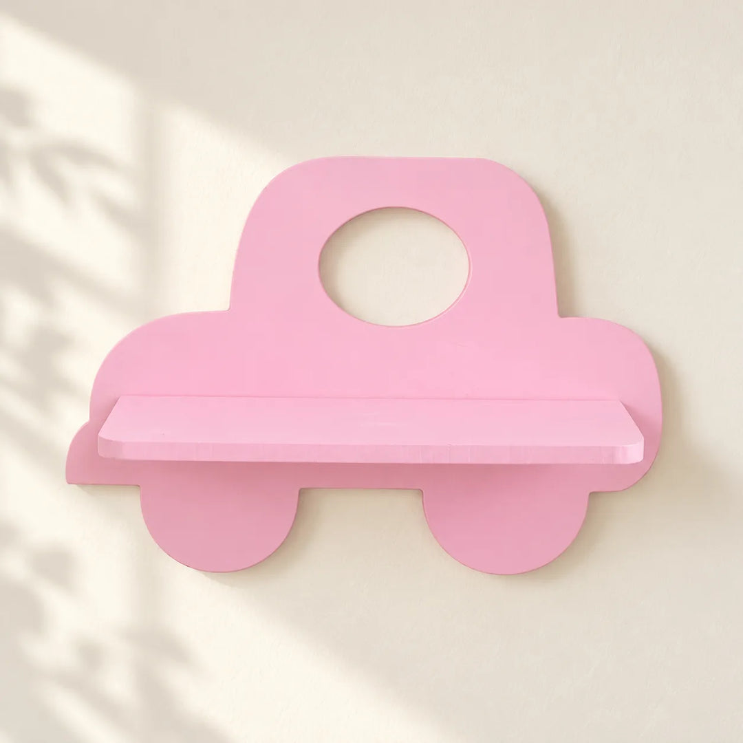 One pink car-shaped Nordic wall shelf with matching pink shelf, shown mounted on an ivory wall