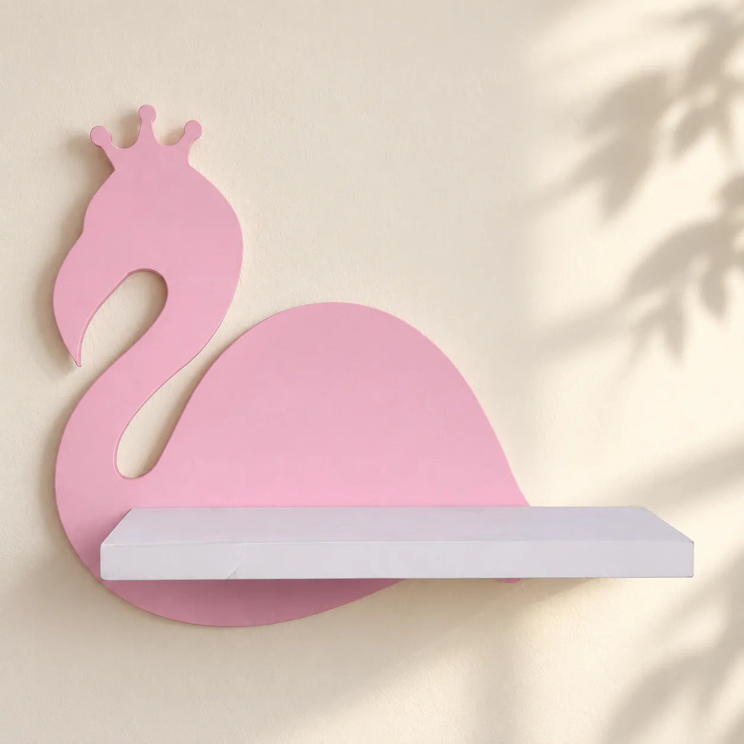 One pink crowned-bird Nordic Flamingo wall shelf with white shelf, shown mounted on an ivory wall