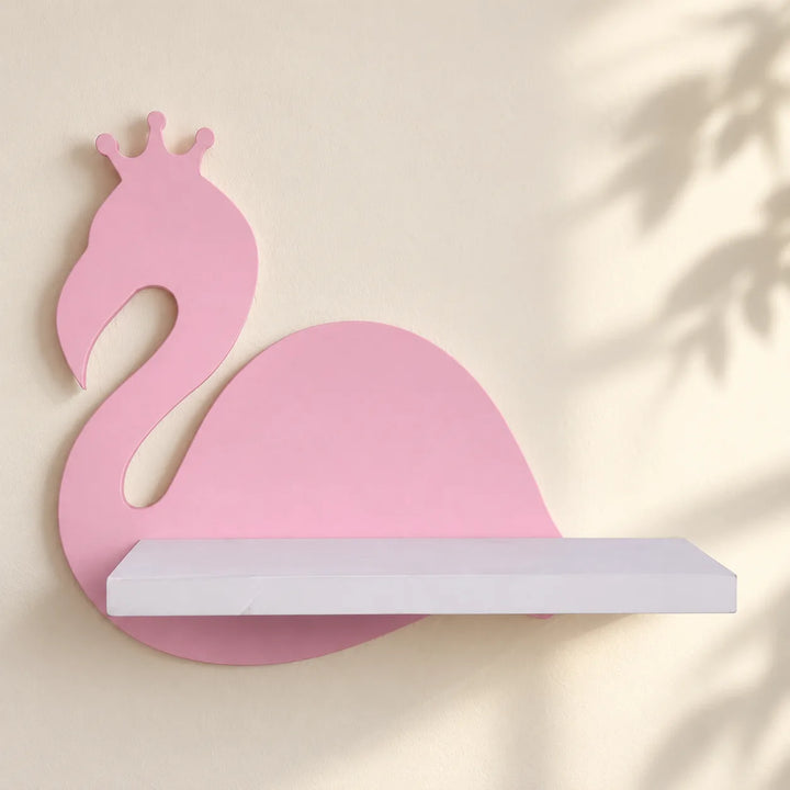 One pink crowned-bird Nordic Flamingo wall shelf with white shelf, shown mounted on an ivory wall