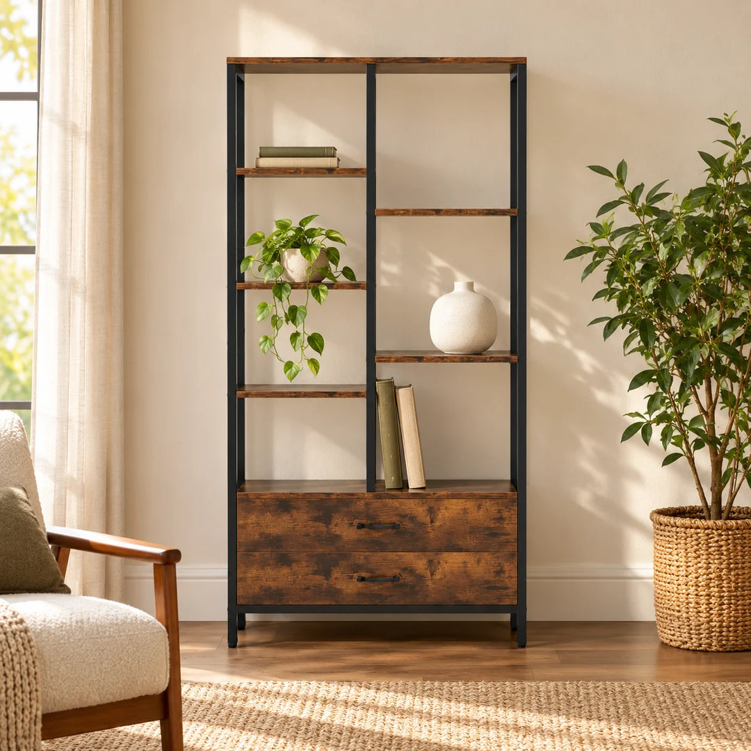 Okara staggered shelf bookcase with two drawers styled with books and plants
