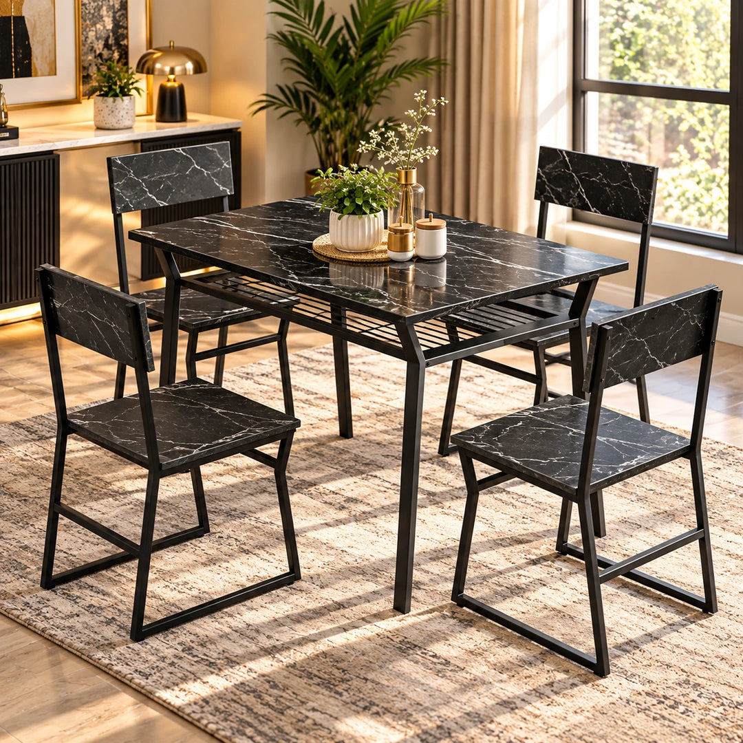 Black marble-look dining table with four matching chairs and black frames