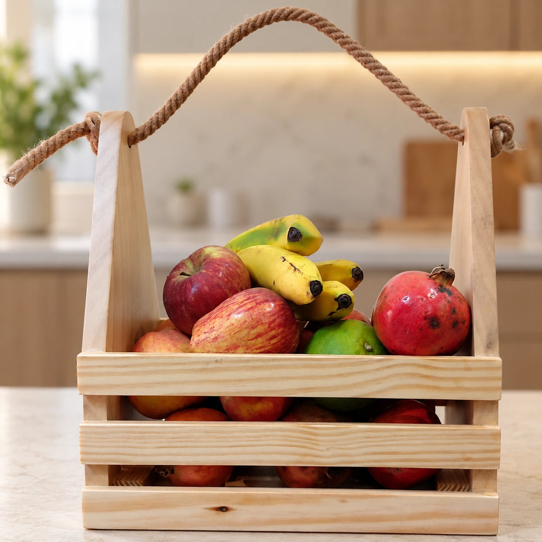 Wooden fruit basket with rope handle on a sunlit kitchen counter