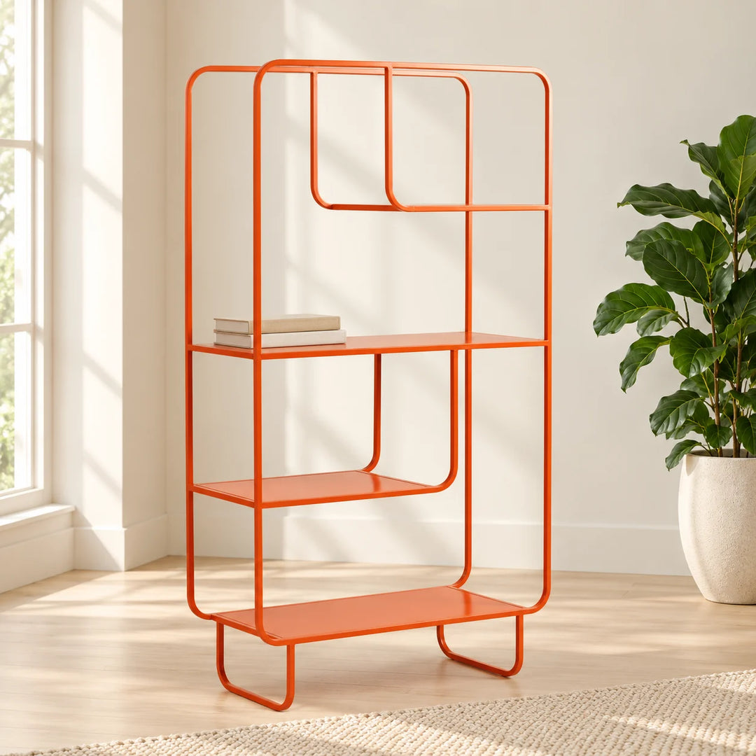 Orange geometric three-shelf bookcase in a natural-light reading nook with books and a natural plant