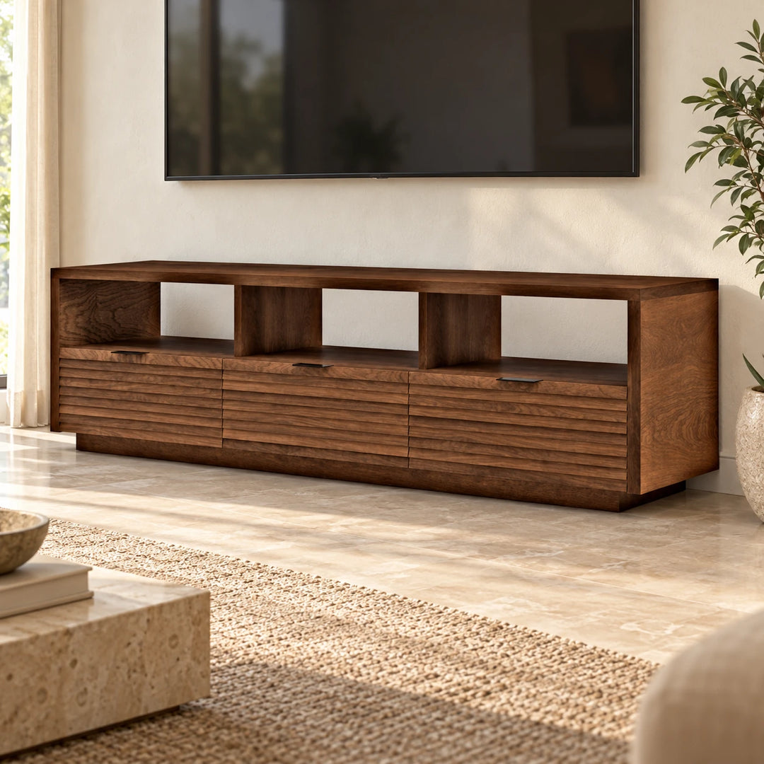 Ponietry walnut TV console with three upper cubbies and three horizontal slatted fronts in a bright living room