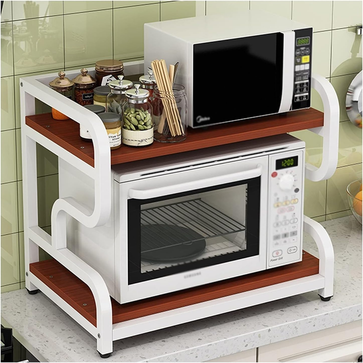 White and walnut two tier oven rack holding a microwave oven and kitchen jars
