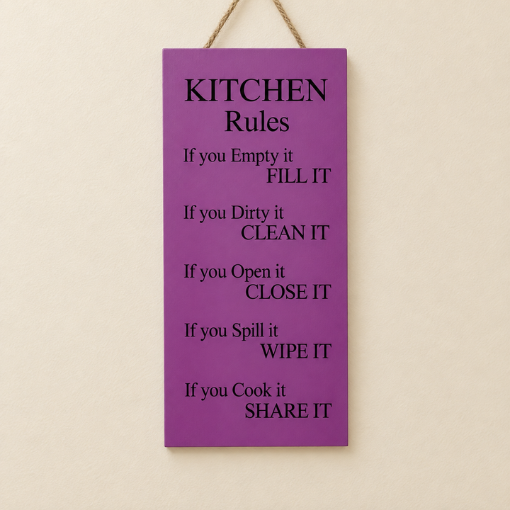 Purple hanging wall decor plaque with Kitchen Rules caption in black text